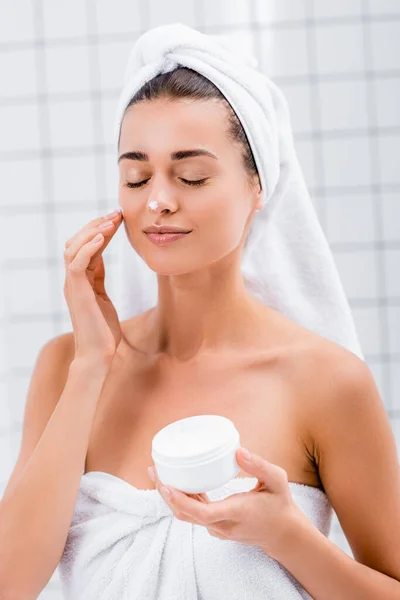 Pleased Woman Closed Eyes White Towel Head Face Cream Nose — Stock Photo, Image