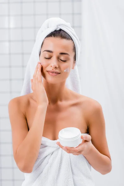 Joyful Young Woman Closed Eyes Applying Cosmetic Cream Face Bathroom — Stock Photo, Image