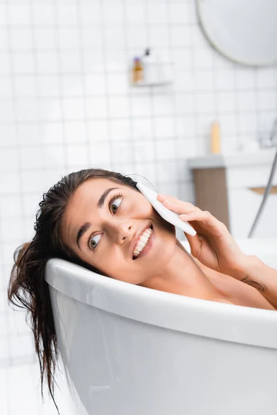 Cheerful Young Woman Looking Away While Taking Bath Talking Smartphone — Stock Photo, Image