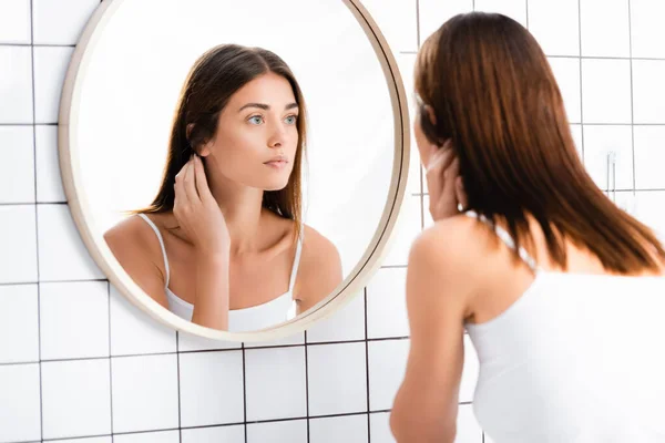 Young Woman White Undershirt Looking Mirror Bathroom — Stock Photo, Image