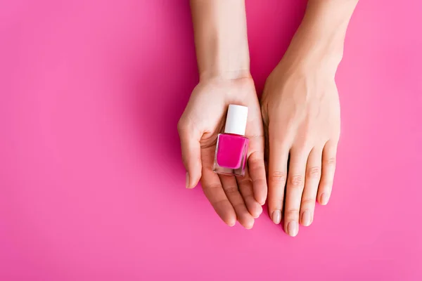 Cropped View Woman Vial Shiny Nail Varnish Pink Background — Stock Photo, Image
