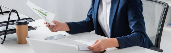 Partial View Businesswoman Holding Papers Charts Graphs Gadgets Desk Banner — Stock Photo, Image