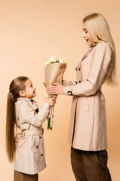 Side View Cheerful Kid Giving Flowers Surprised Mother March Isolated — Stock Photo, Image