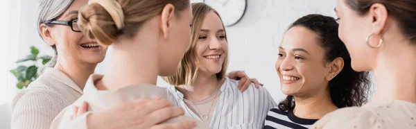 Happy Multicultural Team Hugging Seminar Banner — Stock Photo, Image