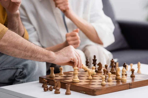 Cropped View Man Playing Chess Wife Blurred Background — Stock Photo, Image