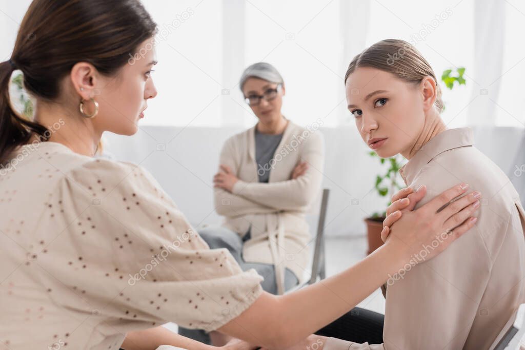 young women supporting each other during seminar 
