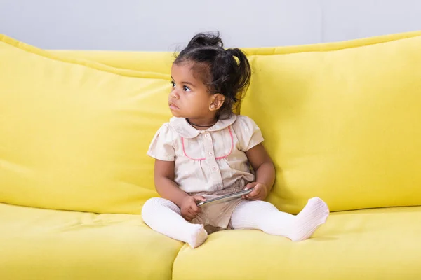 Toddler African American Child Holding Smartphone While Sitting Sofa — Stock Photo, Image