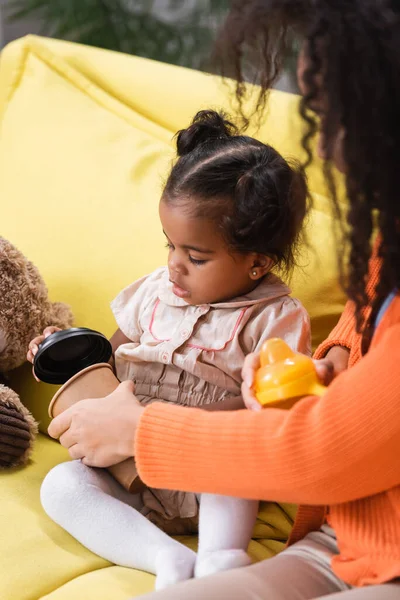 African American Mother Holding Baby Bottle Toddler Daughter Empty Paper — Stock Photo, Image