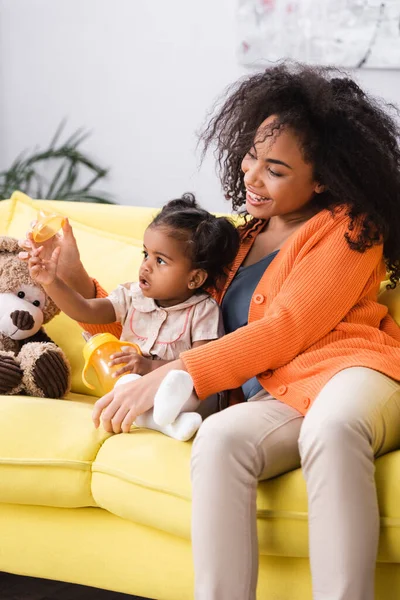Happy African American Mother Sitting Toddler Daughter Baby Bottle — Stock Photo, Image