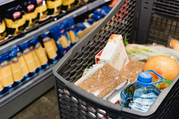 Package Buckwheat Bottle Water Shopping Cart Supermarket — Stock Photo, Image