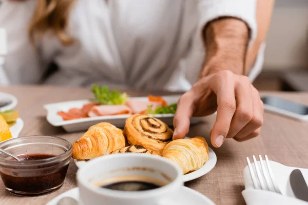 Cropped View Man Taking Croissant Coffee Jam Girlfriend Blurred Background — Stock Photo, Image