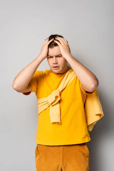 Worried Man Hands Head Looking Away Grey Background — Stock Photo, Image