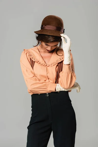 Young Woman Retro Clothes Touching Hat While Standing Bowed Head — Stock Photo, Image