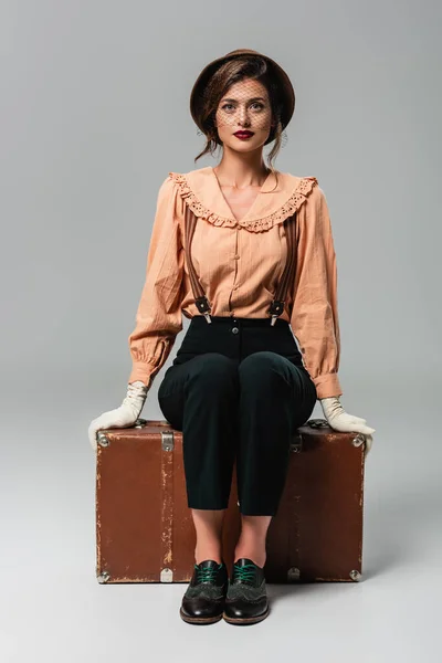 Pretty Stylish Woman Looking Camera While Sitting Vintage Suitcase Grey — Stock Photo, Image