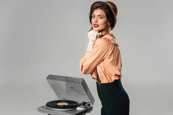 Stylish Woman Hands Face Looking Camera Record Player Isolated Grey — Stock Photo, Image
