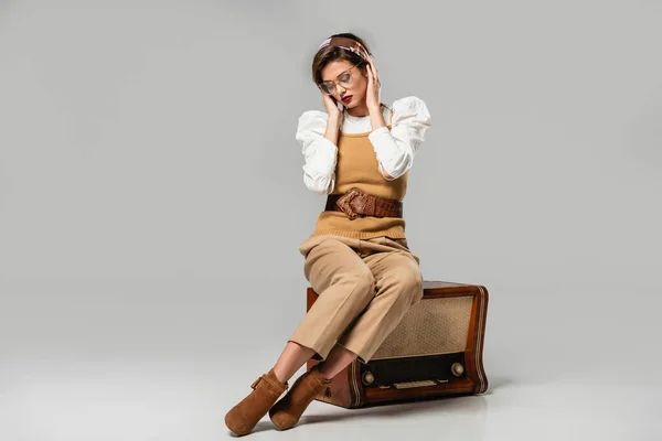 Young Woman Trendy Retro Clothes Adjusting Headband While Sitting Vintage — Stock Photo, Image