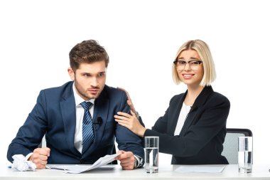 young blonde colleague calming angry colleague at workplace isolated on white clipart