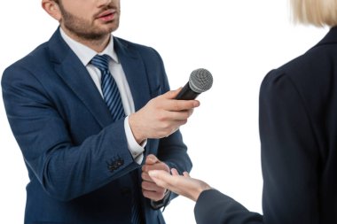 cropped view of newscaster with microphone taking interview from businesswoman isolated on white clipart