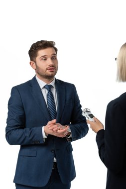 young businessman giving interview to journalist with dictaphone isolated on white clipart