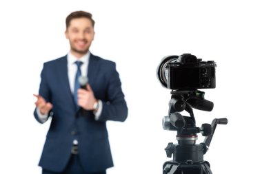 selective focus of digital camera near news anchor on blurred background isolated on white clipart