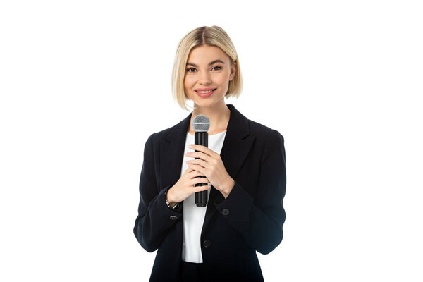 young blonde news presenter with microphone smiling at camera isolated on white