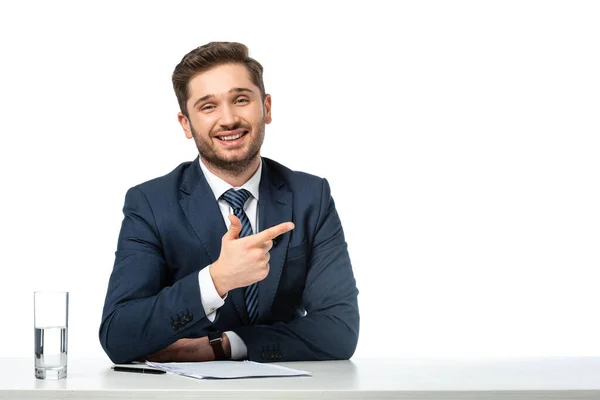 Happy Anchorman Pointing Aside Finger Papers Glass Water Isolated White — Stock Photo, Image