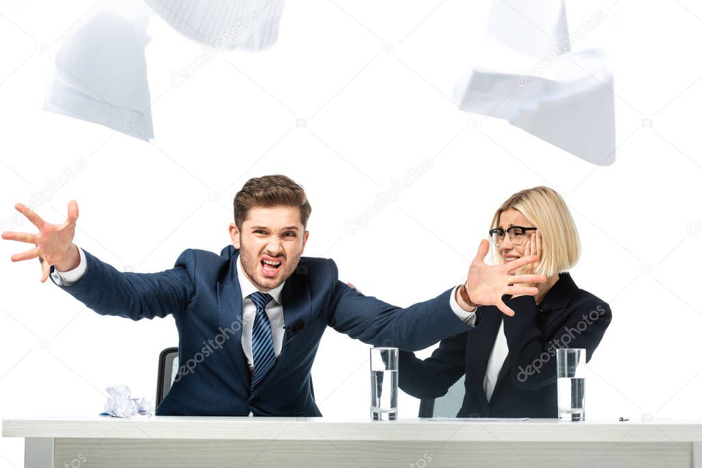 angry news anchor throwing papers near tense colleague isolated on white