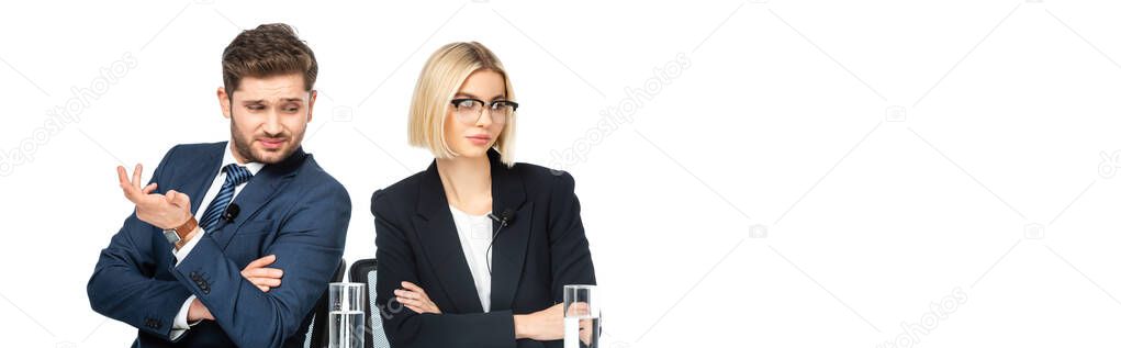 discouraged news commentator gesturing near offended colleague isolated on white, banner