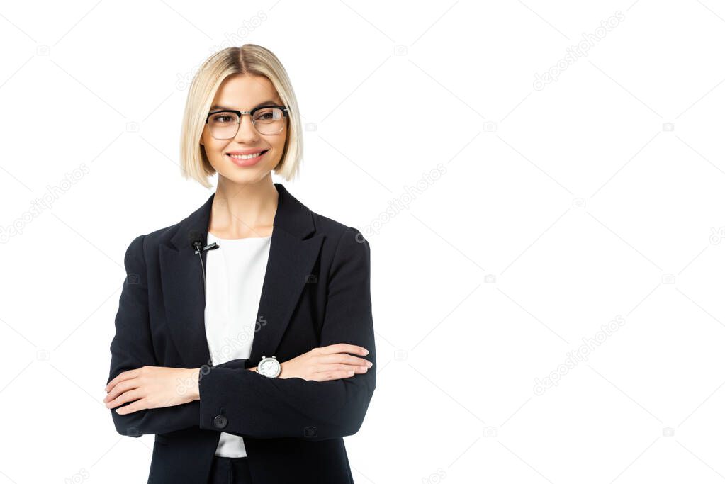 young blonde news commentator with crossed arms looking away isolated on white