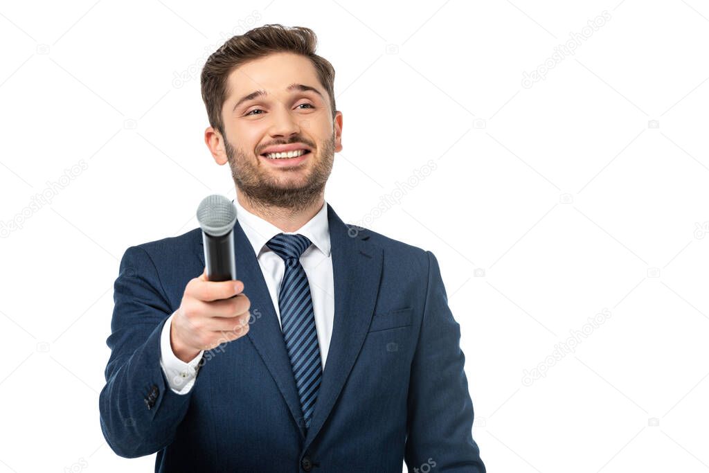 happy news presenter holding microphone while looking away isolated on white