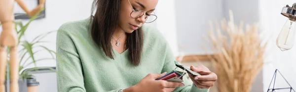 Young African American Architect Holding Samples Material While Working Home — Stock Photo, Image