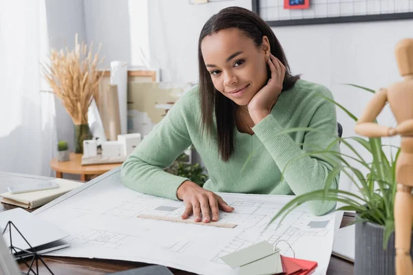 Smiling African American Architect Looking Camera Blueprint Desk Blurred Foreground — Stock Photo, Image