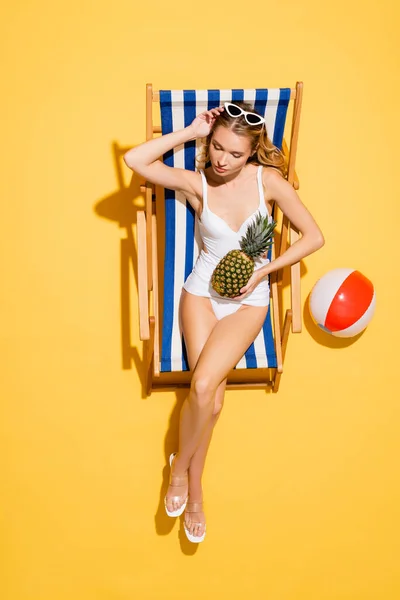 Top View Woman Swimsuit Adjusting Sunglasses While Sitting Deck Chair — Stock Photo, Image