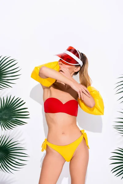 Young Woman Swimsuit Sun Visor Inflating Swim Sleeves White — Stock Photo, Image