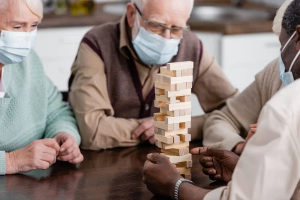 Retired African American Man Medical Mask Playing Tower Wood Blocks — Stock Photo, Image
