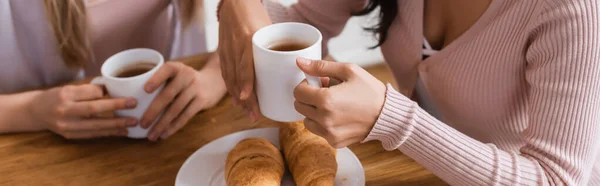 Cropped View Lesbian Couple Holding Cups Croissants Table Banner — 스톡 사진