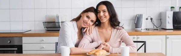 Happy Lesbian Couple Hugging Breakfast Kitchen Table Banner — Photo