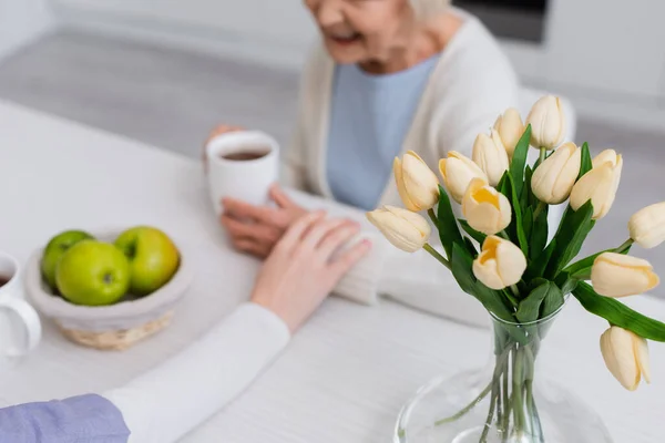 Selective Focus Fresh Tulips Social Worker Touching Hand Elderly Woman — Stock Photo, Image