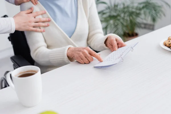 Cropped View Nurse Touching Shoulder Senior Woman Pointing Calendar While — Stock Photo, Image