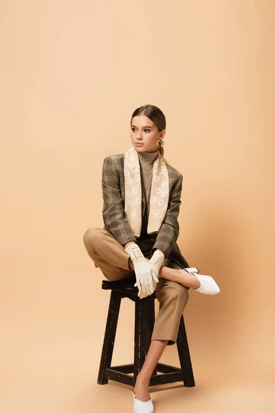 Young Woman Plaid Blazer Pants White Gloves Looking Away While — Stock Photo, Image