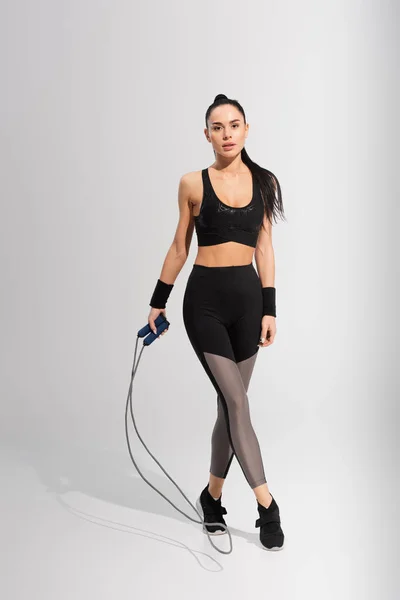 Full Length Young Woman Sportswear Holding Skipping Rope Grey — Stock Photo, Image