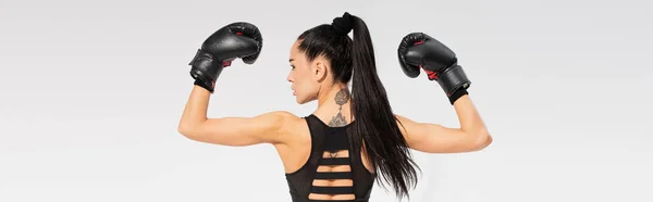 Back View Tattooed Sportswoman Boxing Gloves Isolated Grey Banner — Stock Photo, Image