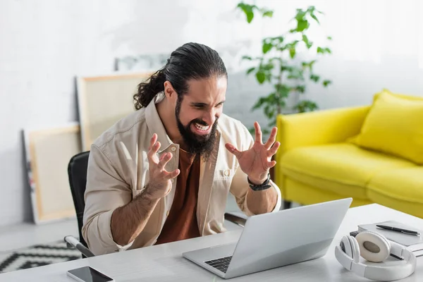 Irritated Latin Freelancer Gesturing While Looking Laptop — Stock Photo, Image