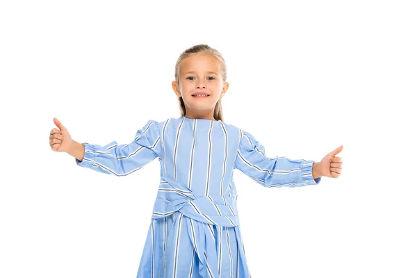 Menina sorridente no vestido mostrando como gesto isolado no branco — Fotografia de Stock