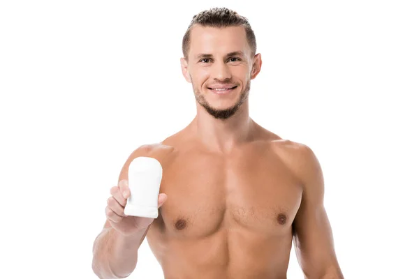 Улыбающийся сексуальный мужчина без рубашки с дезодорантом изолирован на белом — стоковое фото