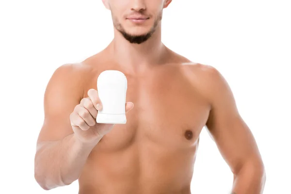 Vista ritagliata di sexy uomo senza camicia con deodorante isolato su bianco — Foto stock