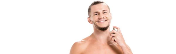 Smiling sexy shirtless man in towel with perfume isolated on white, banner — Stock Photo