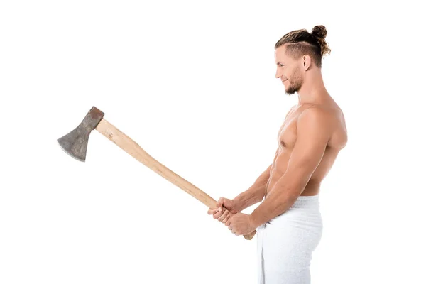 Side view of sexy shirtless man in towel posing with ax isolated on white — Stock Photo