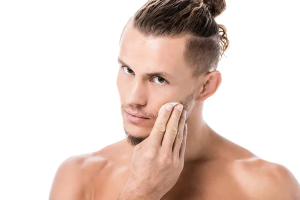 Sexy shirtless man using cotton pad isolated on white — Stock Photo