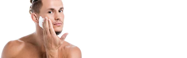 Sexy shirtless man applying foam on face isolated on white, banner — Stock Photo